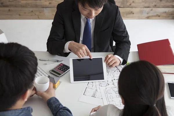 Young couple meeting financial consultant for credit loan