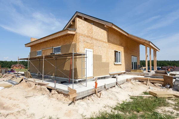 Construction or repair of  house with insulation, eaves, windows, garage,chimney, roofing, fixing facade and plastering