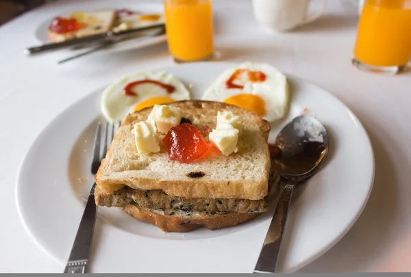 Bread and jam on white disk in happy morning meal feeling