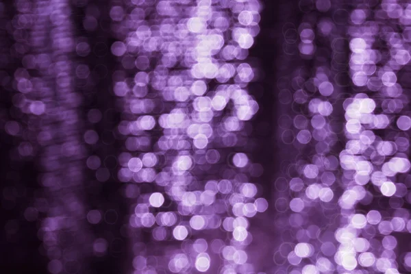 Violet purple abstract shining glow light bokeh background