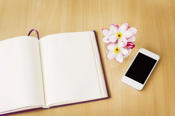 Smartphone and blank note book or diary in relax mood