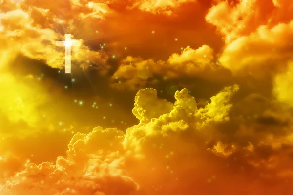 Light from crucifix or cross in golden dreamy heaven sky