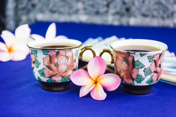 Double cup of tea in lovely flower pattern mini cups