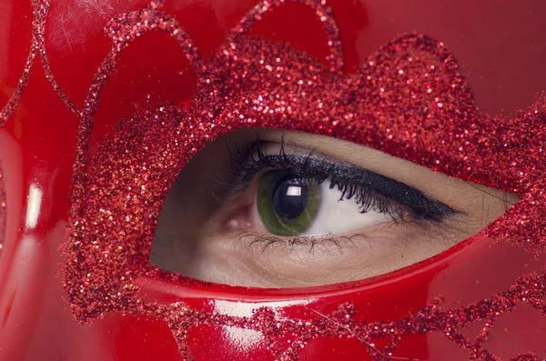 Young lady with a glamour red mask