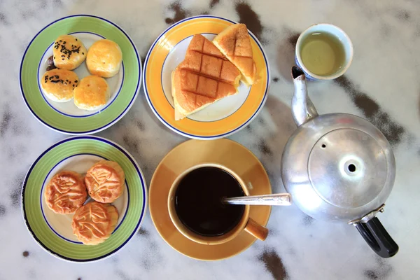 Traditional Black coffee, Cake, Moon Cake, Chinese Tea on wooden