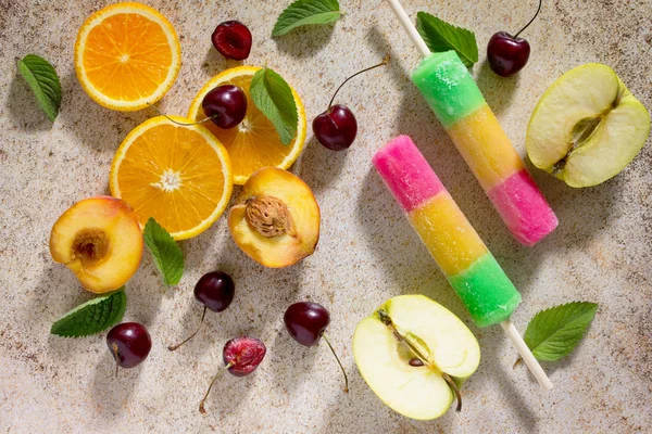 Delicious fruit ice traffic light with cherry, orange and apple