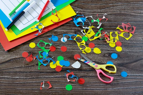 Children cardboard crafts - colored circles, cut. Scissors, glue