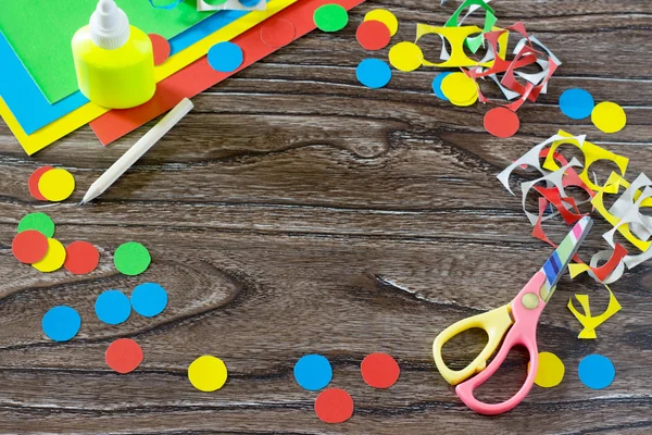 Children cardboard crafts - colored circles, cut. Scissors, glue