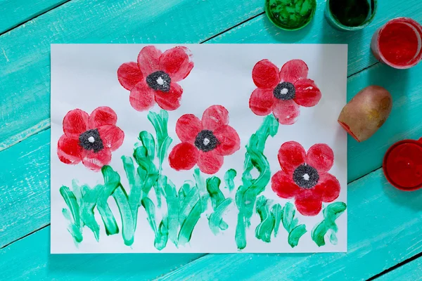 Drawing on paper poppies made in the technique of fingerprint po