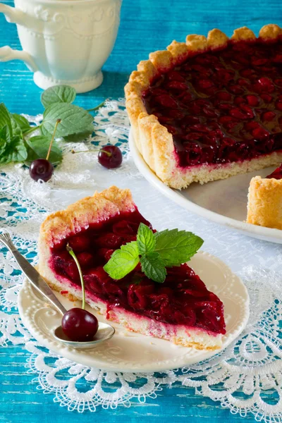 Homemade cherry pie, shortbread dough and cherry jelly on top