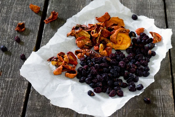 Various dried fruits: apples and dried cherries.