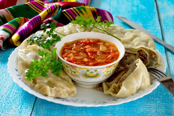 Khanum - a traditional Uzbek dish. Roll lazy dumplings with meat