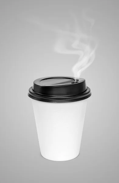 Blank hot coffee cup with steam isolated on gray background