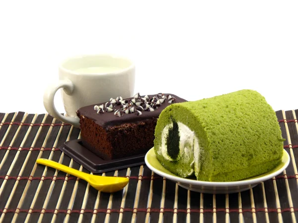 Green tea cake rolls and sweet brownies chocolate cakes