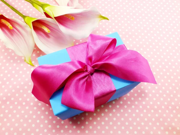 Gift box on sweet polka dot background