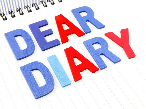 Dear diary word on white paper notebook concept background