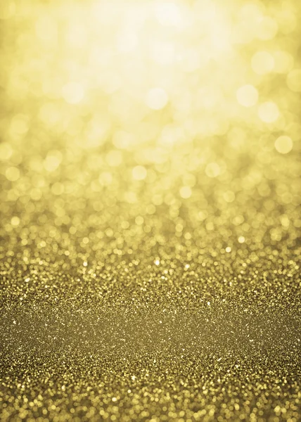 Defocused gold sparkle glitter lights background