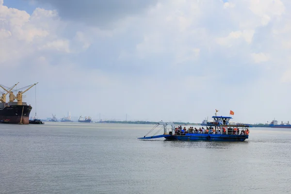 Ho Chi Minh City, Vietnam - June 27, 2015 - an active ferry transporting vehicles and passengers transportation across the river transportation in HoChiMinh City, Vietnam