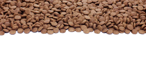 Dry brown pet food (dog or cat) on white background