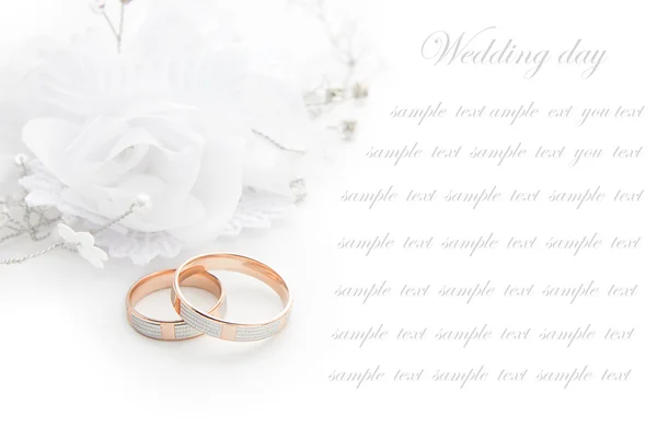 Wedding rings on wedding card  on a white background