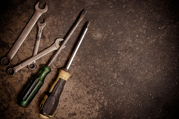 Old tool renovation on grunge cement floor