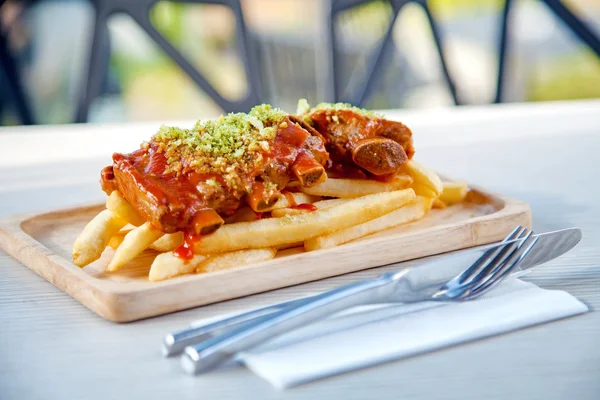 Pork ribs grill sauce with french fries on wood table in the restaurant