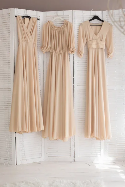 Three bridesmaids\' dresses
