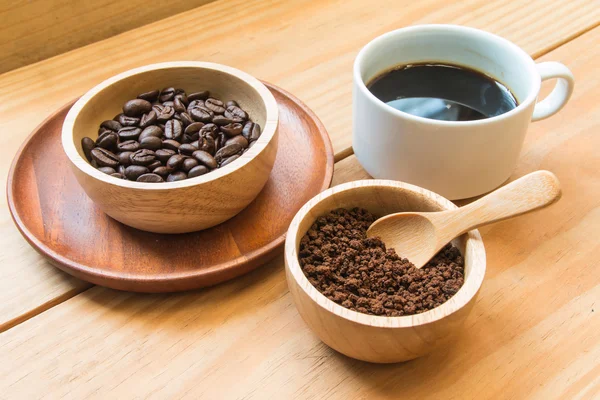 Instant coffee and coffee beans with white cup of coffee