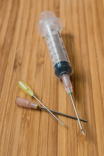Syringe on the wood 3