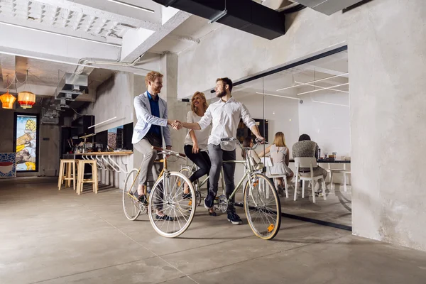 Businessmen riding bicycles to work