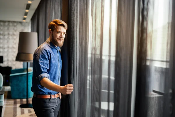 Handsome man looking at cityscape