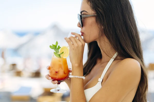 Beautiful woman drinking cocktail