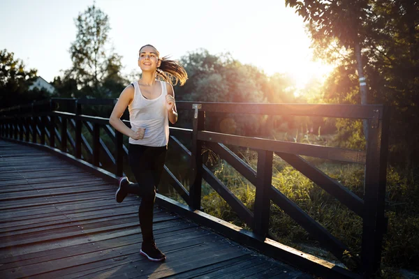 Athletic woman jogging outdoors