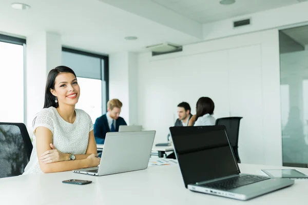 Professional businesswoman sitting at an office desk