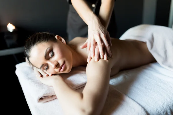 Lady having her shoulder and body massaged