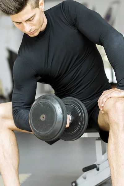 Young man training in a gym