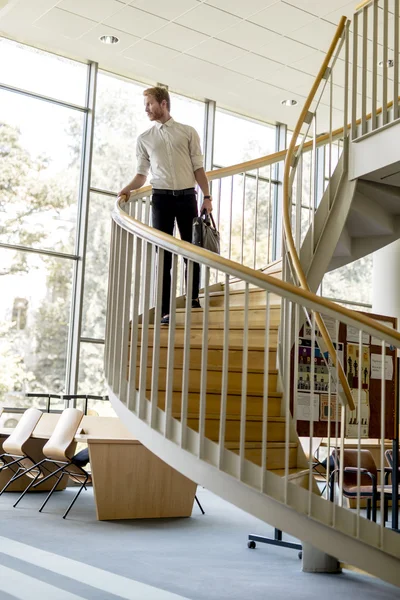 Businessman walking down the stairs