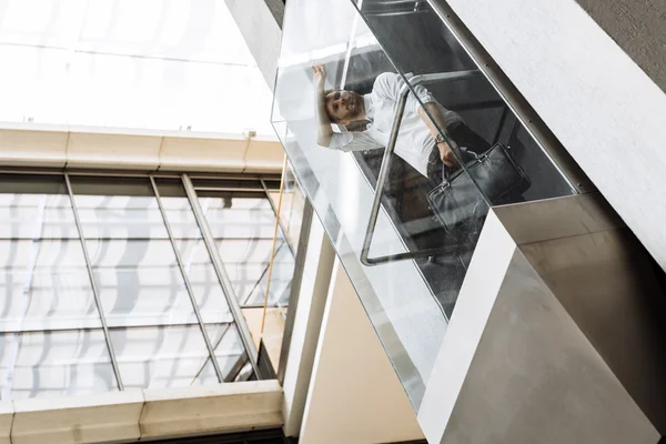 Businessman taking the elevator