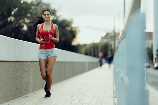 Woman jogging in city