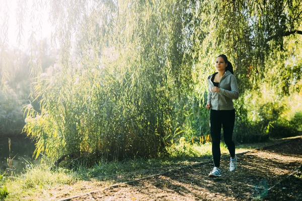 Female jogger running in nature