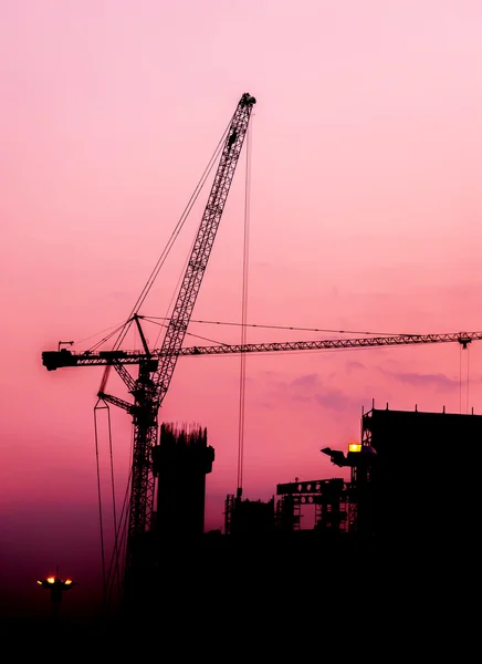 Construction silhouette at sunset