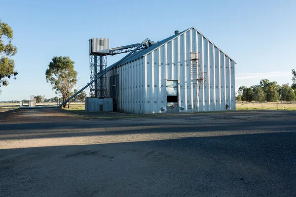 Grain store set against a blue sky