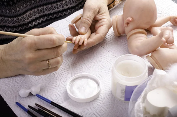 Hand painted reborn dolls. Painting brush fingers.