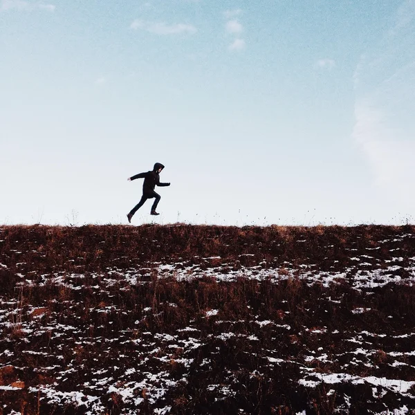 Man running on meadow