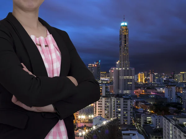 Smart business woman with modern building background 1