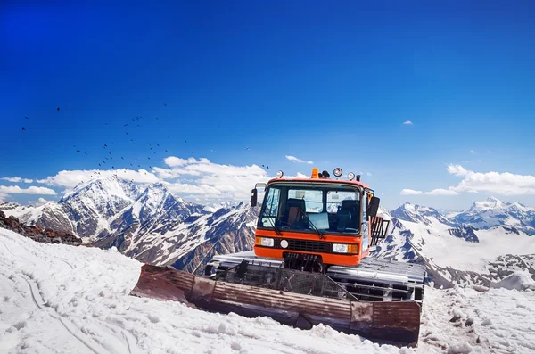 Snow machines in the Caucasus Mountains clear sunny day