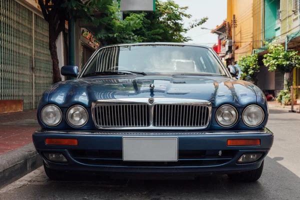 Jaguar Sovereign parked on the street of Bangkok