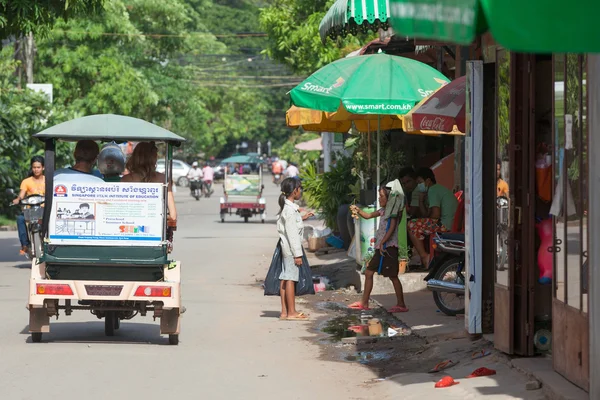 Cambodian children searching for food on the streets of Siem Rea
