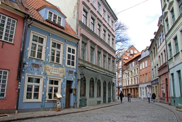 RIGA, LATVIA - MARCH 19, 2012: Jauniela street in Riga with building of restaurant 1221 in the historic house of Old Town