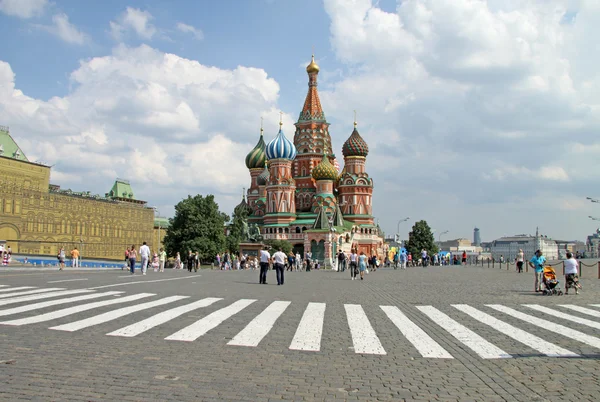 MOSCOW, RUSSIA - JUNE 11, 2010: Pedestrian crossing in front of St. Basil\'s Cathedral on Red Square, Moscow.